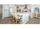 Spacious kitchen featuring an island with barstools and stainless steel appliances at 6976 Pumpkinseed Dr, Johns Island, SC 29455