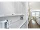 Bright kitchen featuring sleek white countertops and cabinets plus stainless steel appliances at 6976 Pumpkinseed Dr, Johns Island, SC 29455