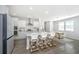 Modern kitchen featuring a large island with bar seating and stainless steel appliances at 6976 Pumpkinseed Dr, Johns Island, SC 29455