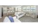 Open-concept living room with modern furniture, wood floors and easy access to the kitchen at 6976 Pumpkinseed Dr, Johns Island, SC 29455
