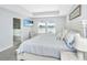 Serene primary bedroom with tray ceilings, large windows, and a view at 6976 Pumpkinseed Dr, Johns Island, SC 29455