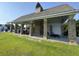 Community pool pavilion, featuring brick columns, fireplace, and lounge chairs at 6976 Pumpkinseed Dr, Johns Island, SC 29455
