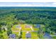 Aerial view of a residential area with well-maintained homes and verdant trees at 708 Tierra Loop, Summerville, SC 29483