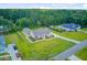 Aerial view of the property, featuring a well-maintained lawn and surrounding trees at 708 Tierra Loop, Summerville, SC 29483