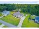 Overhead shot of a home with private driveway, detached storage building, and a large green yard at 708 Tierra Loop, Summerville, SC 29483