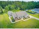 Aerial view of a well-kept home with lush landscaping, an inground pool, and a large private backyard at 708 Tierra Loop, Summerville, SC 29483