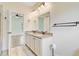 Bathroom featuring double sinks with granite counters, tile floors and neutral walls at 708 Tierra Loop, Summerville, SC 29483