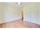 Inviting bedroom with hardwood floors, a ceiling fan, and a double door closet at 708 Tierra Loop, Summerville, SC 29483