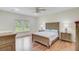 Bright bedroom featuring hardwood floors, a ceiling fan, and natural light from a window at 708 Tierra Loop, Summerville, SC 29483
