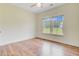 Bedroom featuring hardwood floors, a ceiling fan, and a view of the backyard at 708 Tierra Loop, Summerville, SC 29483