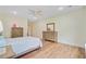 Neutral bedroom featuring wood floors, ceiling fan and a large dresser at 708 Tierra Loop, Summerville, SC 29483