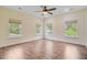 Bright bedroom with wood floors and three windows at 708 Tierra Loop, Summerville, SC 29483