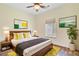 Bright bedroom with hardwood floors, ceiling fan, and stylish, contemporary decor at 708 Tierra Loop, Summerville, SC 29483