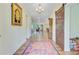 Open foyer with hardwood floors, modern lighting, and a decorative rug leading to a spacious living area at 708 Tierra Loop, Summerville, SC 29483