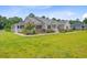 Charming single-story home with large manicured front yard, stone accents, and inviting front porch at 708 Tierra Loop, Summerville, SC 29483