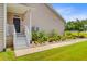Charming home entrance with manicured landscaping, a covered porch, and a well-maintained lawn at 708 Tierra Loop, Summerville, SC 29483