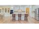 Modern kitchen with stainless appliances, central island, and barstool seating that combines style with functionality at 708 Tierra Loop, Summerville, SC 29483