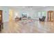 Open living area with hardwood floors, plenty of sunlight, and comfortable seating creating an inviting and spacious atmosphere at 708 Tierra Loop, Summerville, SC 29483