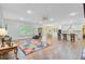 Spacious, open-concept living space with natural light, hardwood floors, and comfortable seating, ideal for modern living at 708 Tierra Loop, Summerville, SC 29483