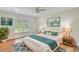Bright and airy main bedroom with wood floors, a ceiling fan, and a king sized bed at 708 Tierra Loop, Summerville, SC 29483