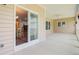 A screened porch with dining table adjacent to the interior dining room at 708 Tierra Loop, Summerville, SC 29483