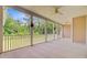 Expansive screened porch with ceiling fans overlooks the yard at 708 Tierra Loop, Summerville, SC 29483