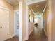Hallway with hardwood floors leading to the living room at 713 Breakers Reef Ln, Huger, SC 29450