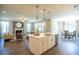 Open concept living room and kitchen area, perfect for entertaining guests at 713 Breakers Reef Ln, Huger, SC 29450