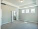Spacious main bedroom with tray ceilings and an ensuite bathroom at 713 Breakers Reef Ln, Huger, SC 29450