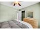 Well-lit bedroom with a ceiling fan and closet for ample storage at 721 Lake Frances Dr, Charleston, SC 29412