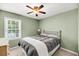 Comfortable bedroom with a ceiling fan, window and neutral paint at 721 Lake Frances Dr, Charleston, SC 29412