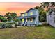 Charming two-story home featuring a covered front porch and well-manicured lawn at 721 Lake Frances Dr, Charleston, SC 29412