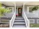 Inviting front porch with decorative details and well-maintained landscaping at 721 Lake Frances Dr, Charleston, SC 29412