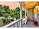 Inviting front porch with views of manicured landscaping and lush greenery at 721 Lake Frances Dr, Charleston, SC 29412
