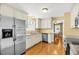 This kitchen features granite countertops, stainless steel appliances, and hardwood floors at 721 Lake Frances Dr, Charleston, SC 29412