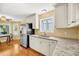 Eat in kitchen with granite countertops, stainless steel appliances, and hardwood floors at 721 Lake Frances Dr, Charleston, SC 29412
