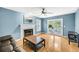 Comfortable living room with a fireplace, hardwood floors, and natural light at 721 Lake Frances Dr, Charleston, SC 29412