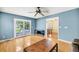 Spacious living room with hardwood floors, ceiling fan, and sliding glass doors leading to backyard at 721 Lake Frances Dr, Charleston, SC 29412