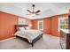 Spacious main bedroom features a tray ceiling, fan, and ample natural light at 721 Lake Frances Dr, Charleston, SC 29412