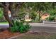 Woodcreek Pointe entrance with brick signage surrounded by lush greenery and mature trees at 721 Lake Frances Dr, Charleston, SC 29412