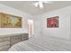 Bedroom featuring hardwood floors, neutral decor, ceiling fan, and dresser with art at 727 Savannah Hwy, Charleston, SC 29407
