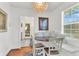 Cozy dining nook features a round table, bench seating, and bright lighting at 727 Savannah Hwy, Charleston, SC 29407