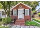 Charming brick home with landscaped yard, brick steps, and black shutter accents at 727 Savannah Hwy, Charleston, SC 29407