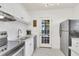Bright kitchen featuring white cabinets, stainless steel appliances, and marble tile flooring at 727 Savannah Hwy, Charleston, SC 29407