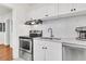 Bright kitchen featuring white cabinets, stainless steel appliances, and mosaic tile backsplash at 727 Savannah Hwy, Charleston, SC 29407