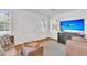 Bright living room featuring hardwood floors, natural light, and access to other areas at 727 Savannah Hwy, Charleston, SC 29407