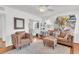 Bright living room with hardwood floors, neutral decor, and comfortable seating area at 727 Savannah Hwy, Charleston, SC 29407