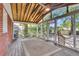 Spacious screened-in porch with ceiling fans, offering a perfect space for relaxation and entertainment at 727 Savannah Hwy, Charleston, SC 29407