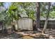 Exterior shot of a metal storage shed in a shady backyard setting with trees at 727 Savannah Hwy, Charleston, SC 29407