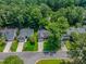 Aerial view of homes with tree coverage, well manicured lawns, and driveways at 808 Long Drive Rd, Summerville, SC 29485